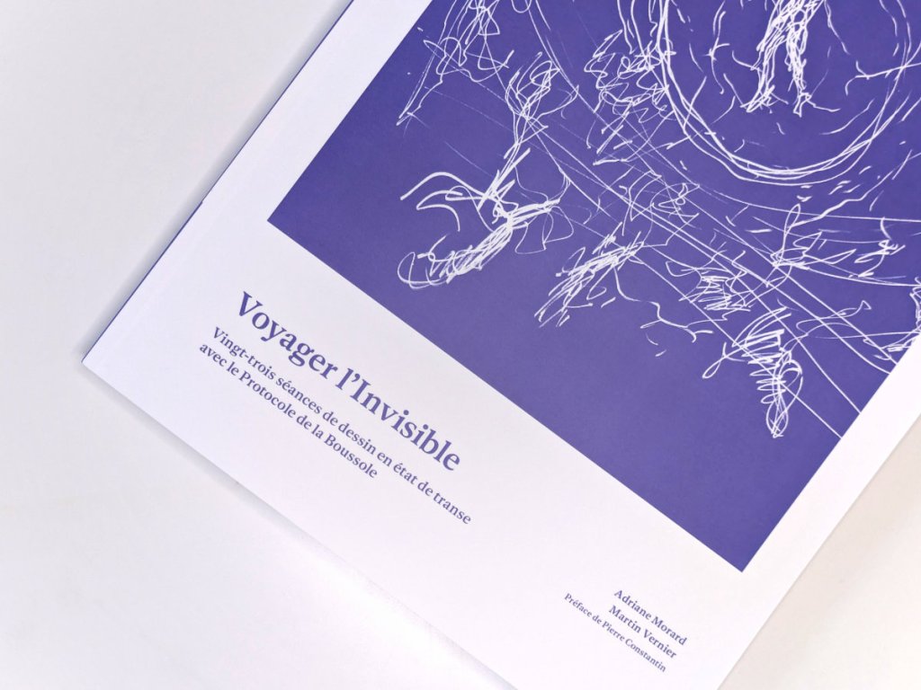 Close, angled view of the Voyager l'Invisible cover. White scribbled line drawing on a blue ground, with the title, subtitle and author names in the lower left corner.
